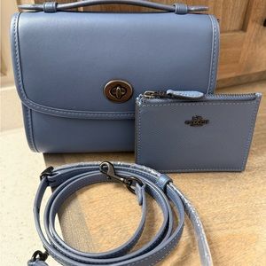 Coach Kip Turnlock Crossbody Bag with Adjustable Strap and matching card case.
